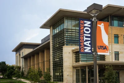 University building with large windows and a banner reading 