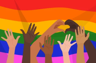 Illustration of diverse hands raised against a rainbow flag background, with two hands forming a heart shape.