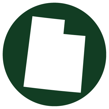 White silhouette of Utah state on a dark green circular background.